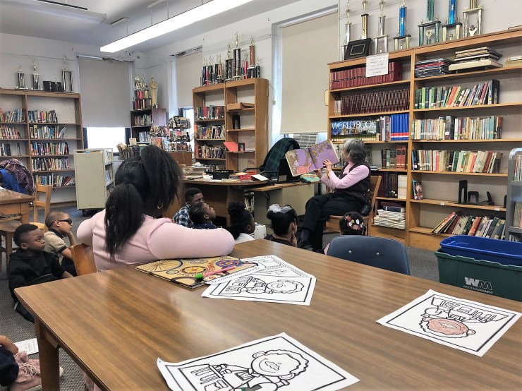 Mrs. Podraza reads to children - Final Project